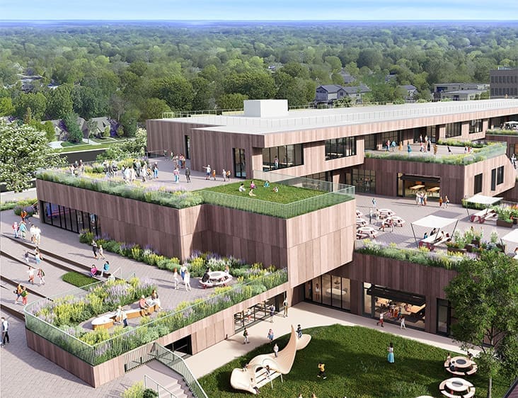 Aerial rendering of the terraced school addition with planted roofs and play terraces.